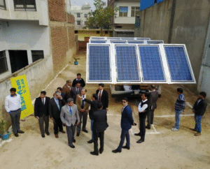 Industry experts and dignitaries at a solar panel demonstration in India — Su-Kam 3-phase solar system launch